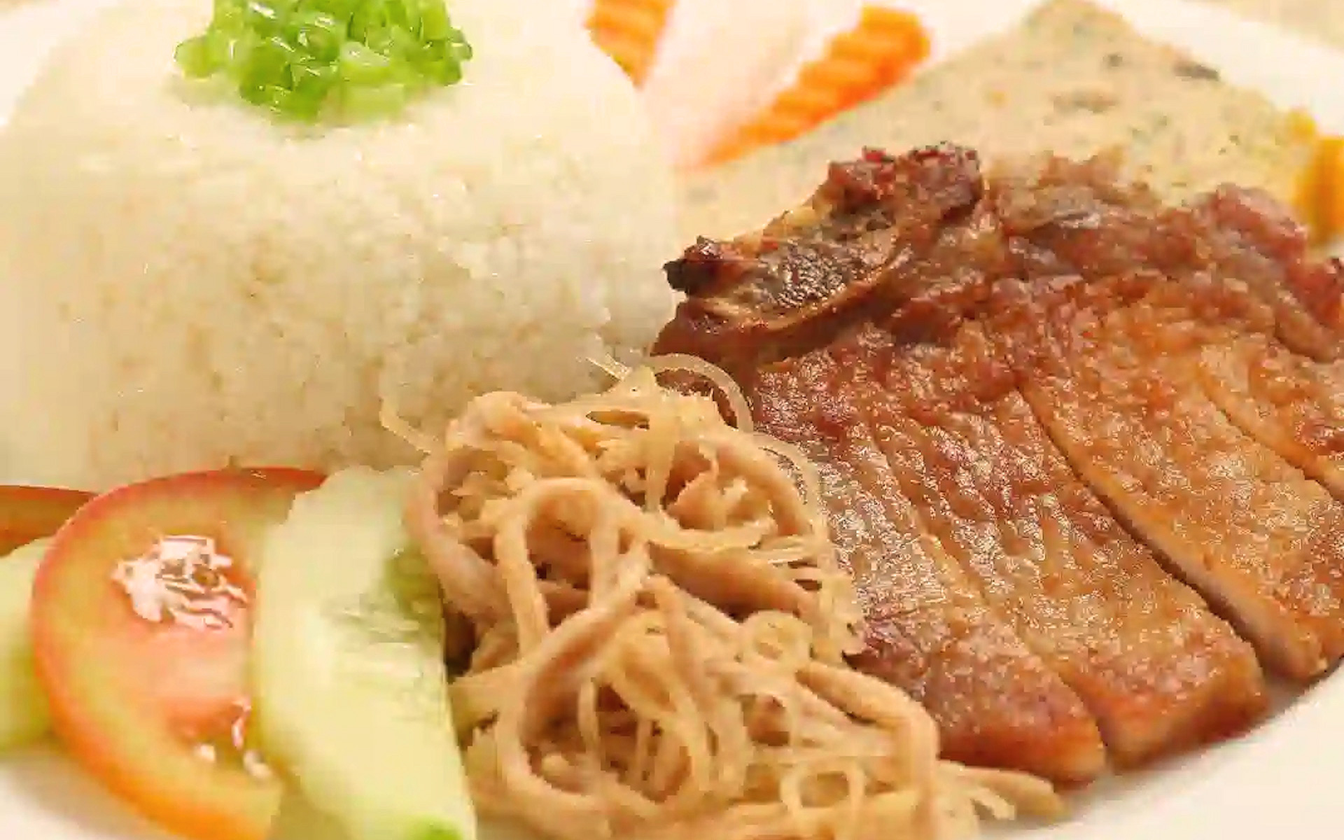 Cơm Tấm, a popular broken rice dish with grilled pork and egg
