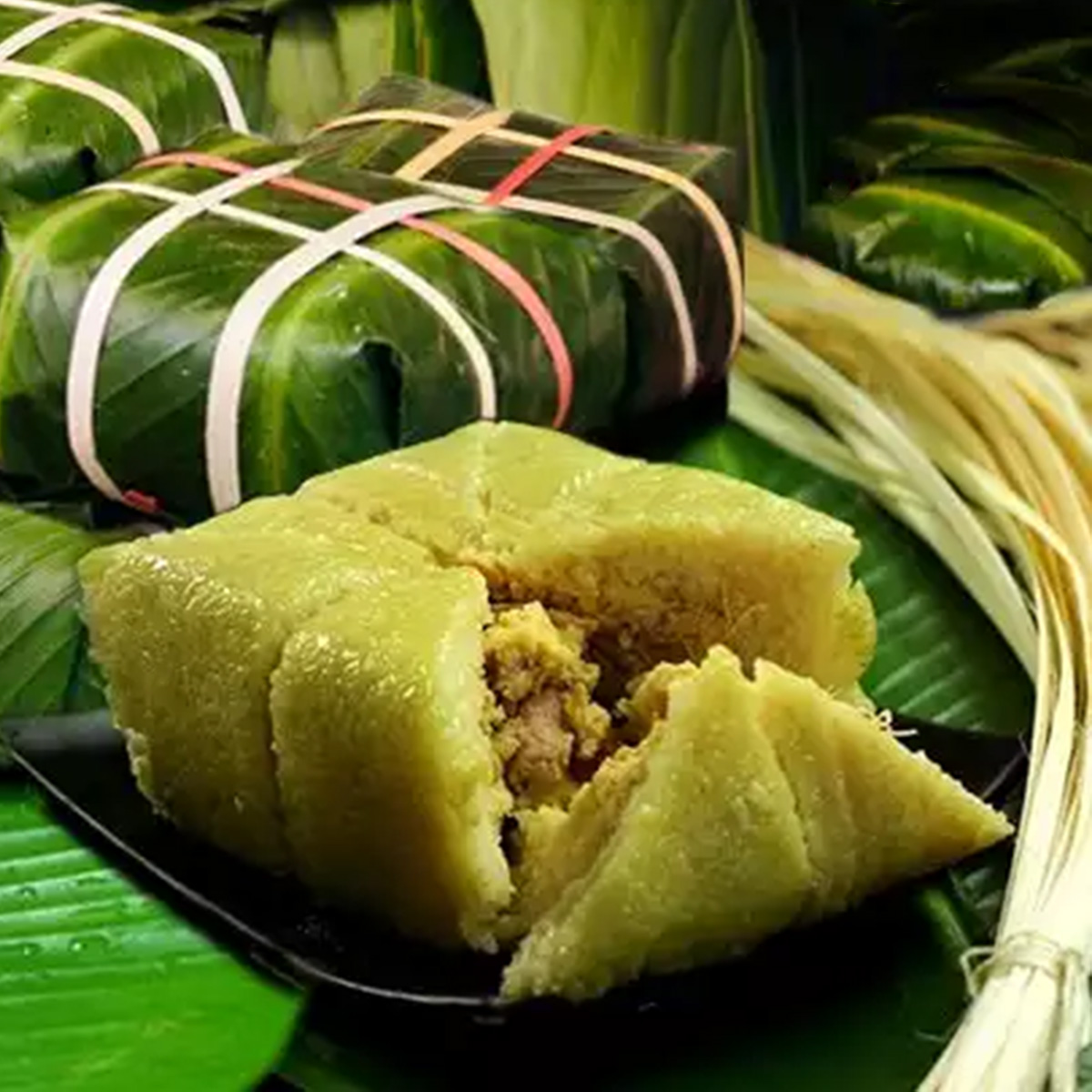 A sliced Banh Chung showing its sticky rice, mung bean, and pork filling