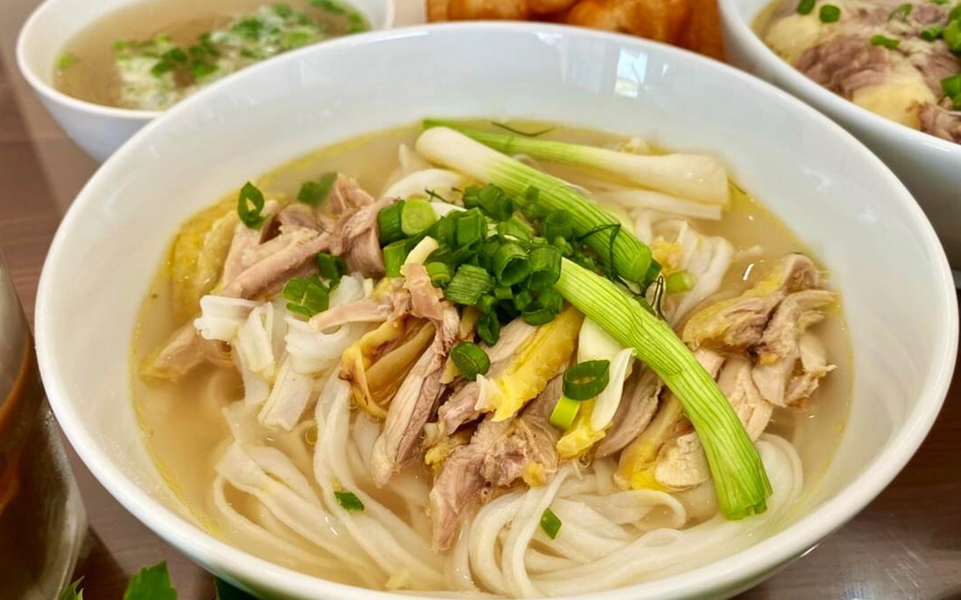 Phở, a traditional Vietnamese noodle soup with beef, chicken, and fragrant broth